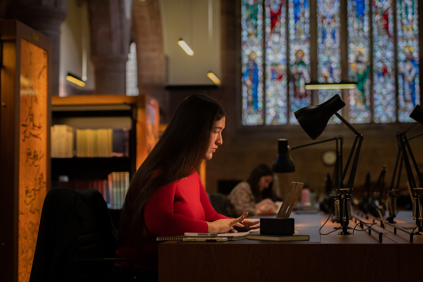 Students studying at desks in Martyrs Kirk